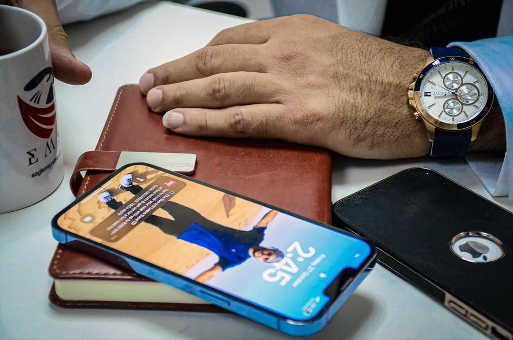 At the desk — notebook, watch and the day's plan